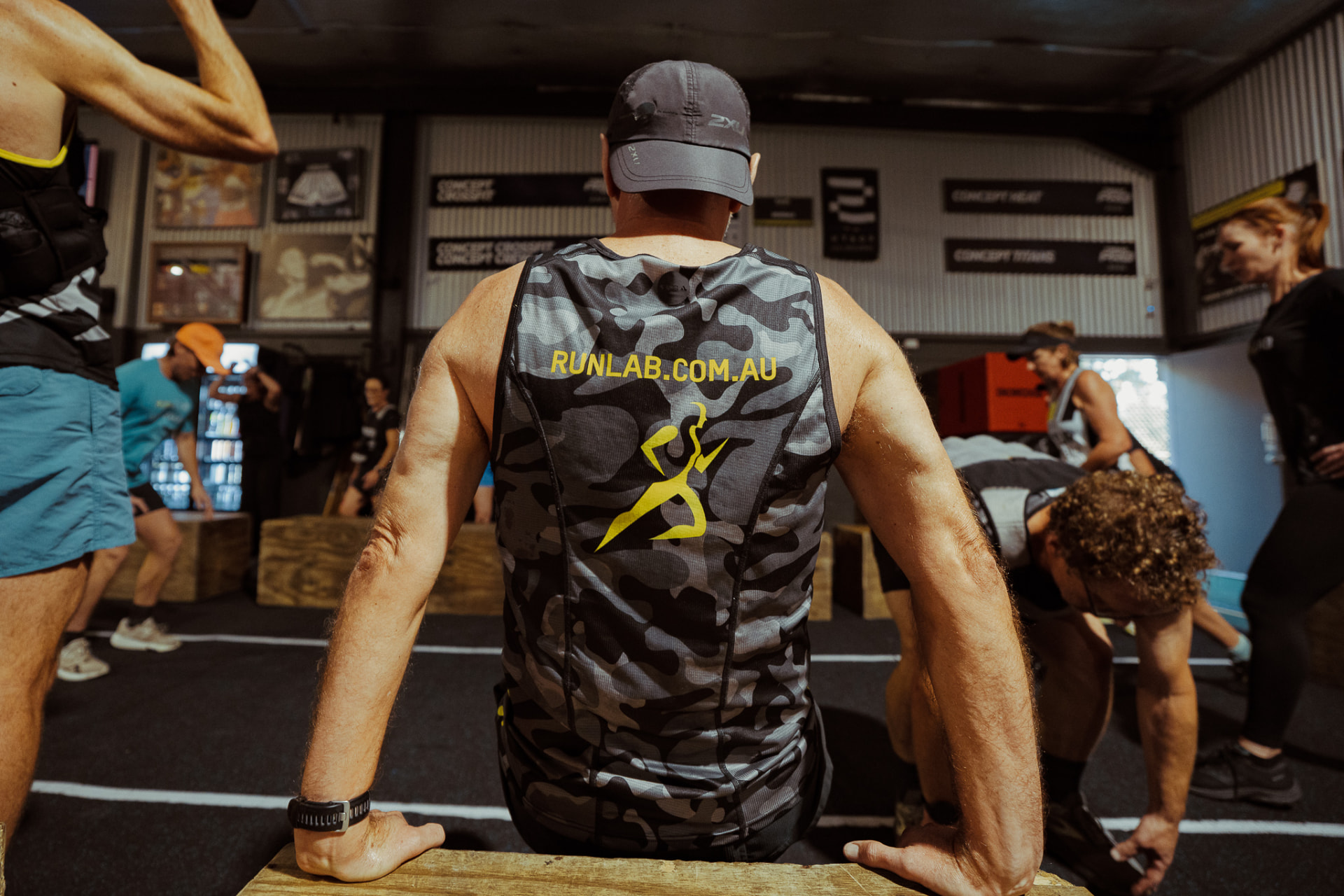 Runner in a RunLab vest resting between reps